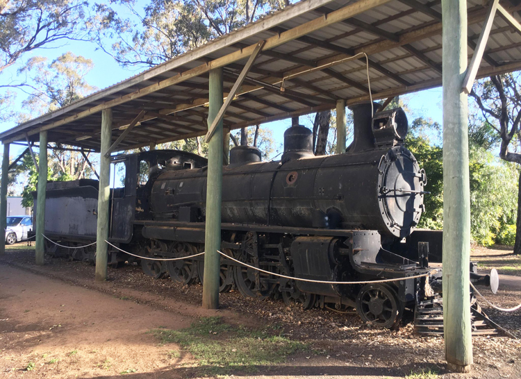 A train is parked under a covered area

Description automatically generated with low confidence