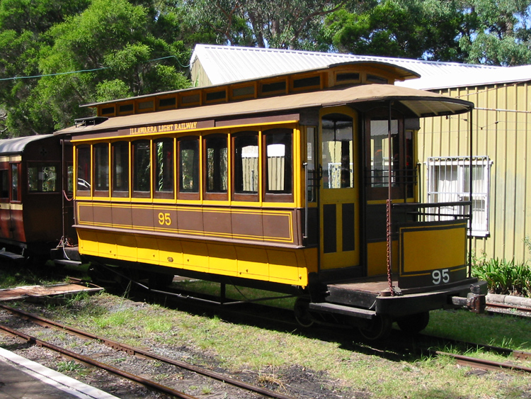 A yellow train on the tracks

Description automatically generated with low confidence