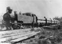 A picture containing railroad, outdoor, sky, steam

Description automatically generated